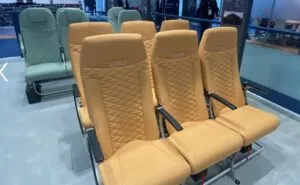 Acro Series 6 seat triples, two in yellow, and behind it one row of green